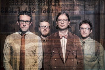 Photo of the members of the band Public Service Broadcasting